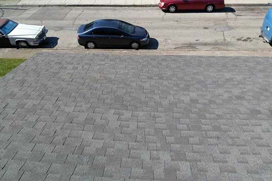 Residential roof with new gray shingles